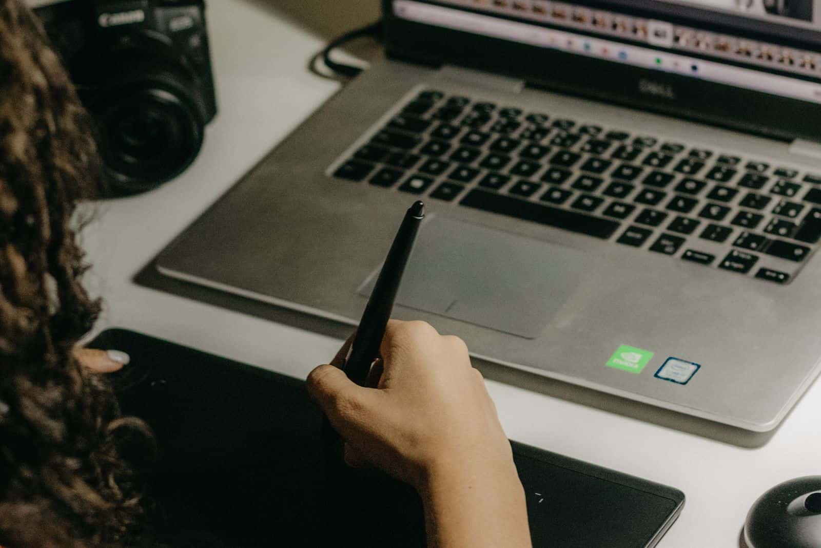 Photographer editing a large set of images on a laptop