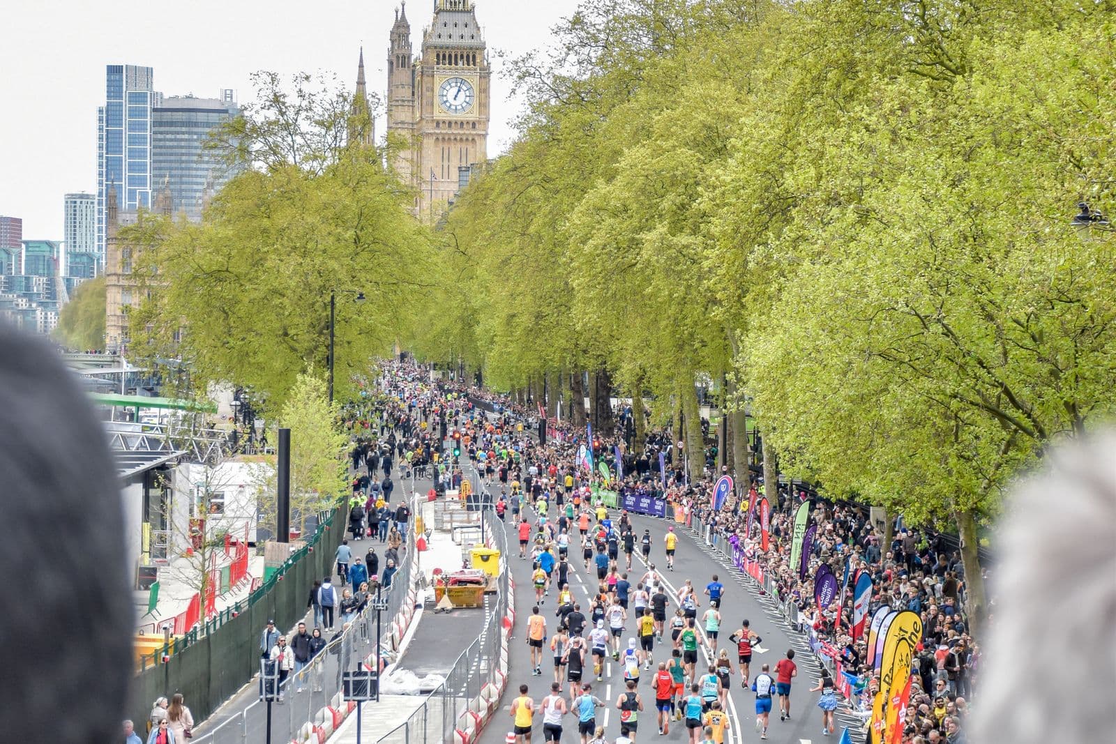City marathon runners and spectators near Big Ben in London